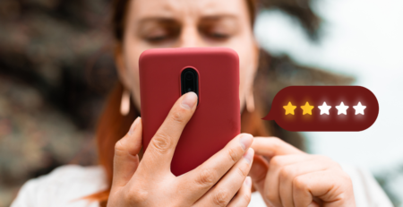 Woman on cell phone. Shows 2 out of 5 star review.