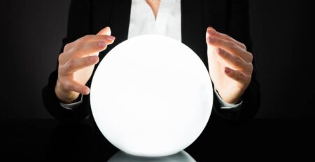 Business woman gazing at a crystal ball | MD Communications