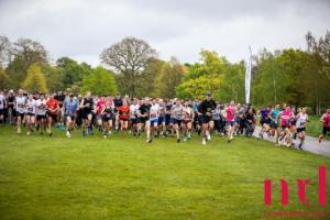 large group of people running at start of race